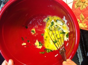 Whisking egg, parsley and cheese